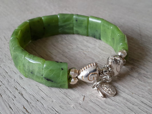 Nephrite jade bracelet with facet cut stones and 925 sterling silver charms, designed for wrist sizes 17-18 cm.